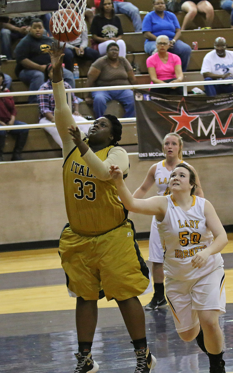 Image: Senior center Shercorya Chance(33) scores 2-points for the Lady Gladiators.