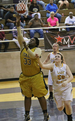 Image: Senior center Shercorya Chance(33) scores 2-points for the Lady Gladiators.