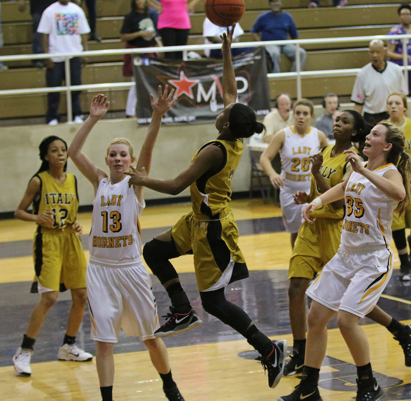 Image: Italy junior Decorea Green(3) elevates toward the rim for 2 more points.