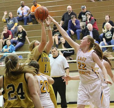 Image: Lady Gladiator Brycelen Richards(11) banks one in over a Lady Hornet defender.