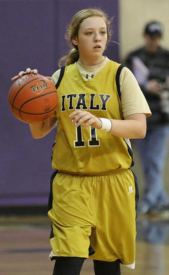 Image: Guard Brycelen Richards(11) handles the ball while setting up Italy’s offensive set.