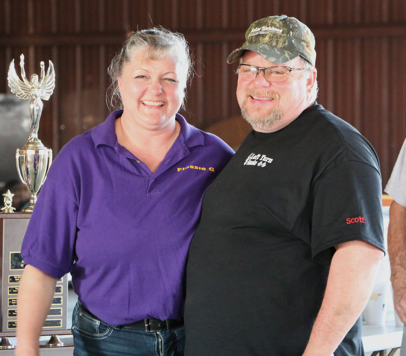 Image: Italy Lions Club member Flossie Gowin congratulates Scott Blanchard, owner of BHB Feed & Supply, LLC of Italy, for his 3rd Place finish in the local Braggin’ Rights category.