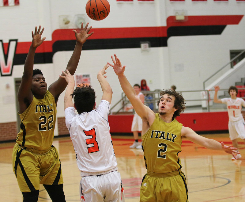 Image: Christion Washington and Ryan Connor attempt to slow down Petrolia in the area championship game.