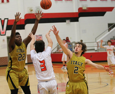 Image: Christion Washington and Ryan Connor attempt to slow down Petrolia in the area championship game.