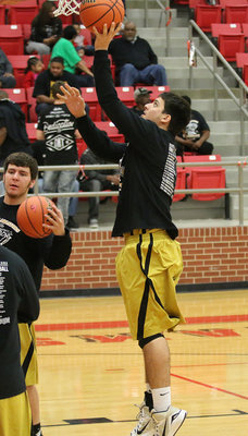 Image: Italy Gladiator senior Mason Womack warms up during the area playoff matchup against Petrolia.