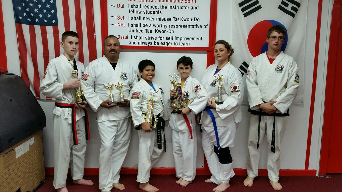 Image: Pictured in these two pictures are: Roger Sam, Nick Sam-Black Belt, Michael Bryant, Jacob Young-Black Belt, Jennifer Procopio and Antonio Procopio; also, one of the instructors Travis Tinney.