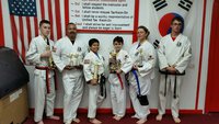 Image: Pictured in these two pictures are: Roger Sam, Nick Sam-Black Belt, Michael Bryant, Jacob Young-Black Belt, Jennifer Procopio and Antonio Procopio; also, one of the instructors Travis Tinney.