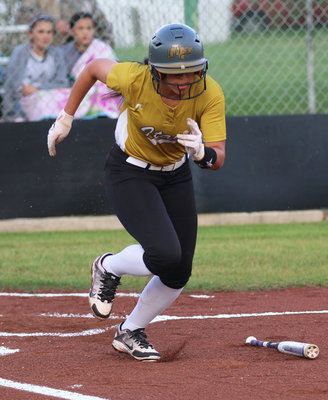 Image: April Lusk starts the game off with a hit for the Lady Gladiators.