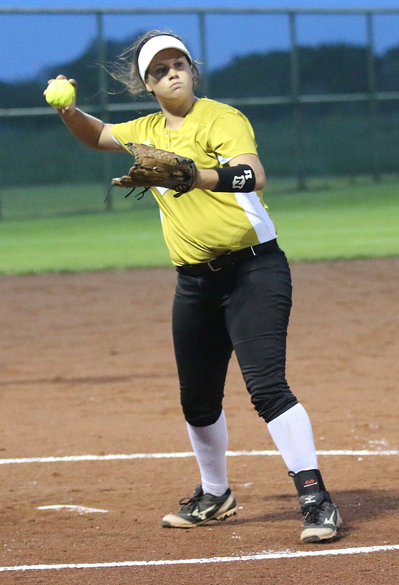 Image: Lady Gladiator pitcher Jenna Holden snags a grounder and then throws to first-base for the out.
