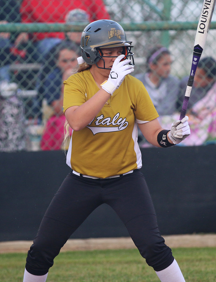 Image: Italy Lady Gladiator Brycelen Richards adjusts her game face before seeing the first pitch from Avalon.