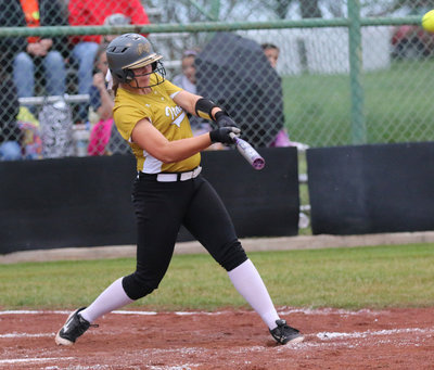 Image: Going….going….gone!!! Senior Lady Gladiator Lillie Perry blasts a homerun ball over the left field fence. It was Perry’s third out-of-the park homer this season and her first in front of the home fans.