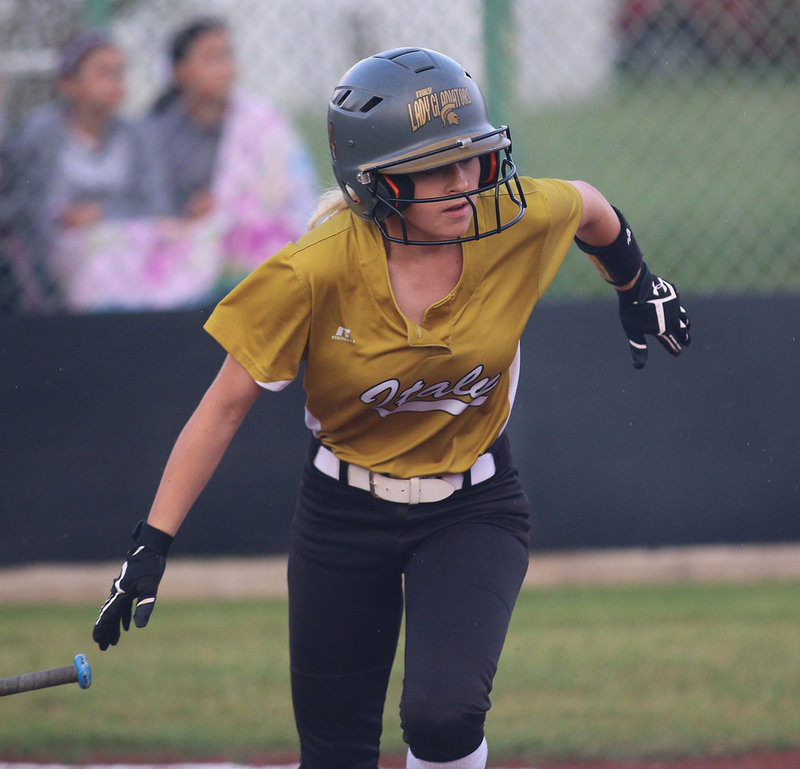 Image: Senior Lady Gladiator Britney Chambers sends a shot into the Lady Eagle outfield.