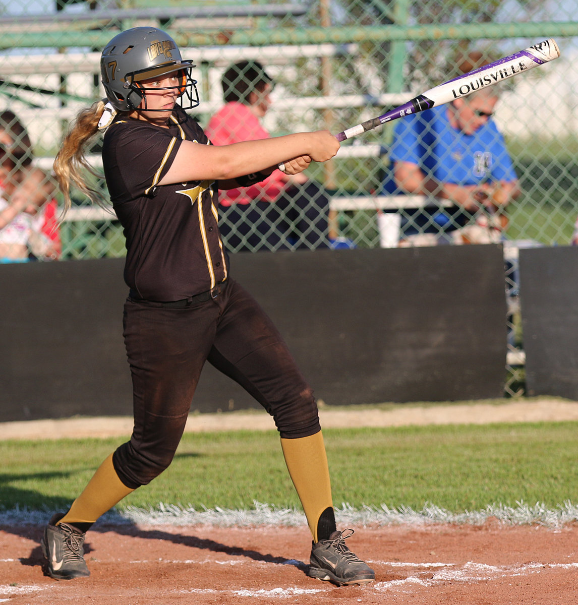 Image: Italy’s Brycelen Richards(17) gets to third base with this rocket launcher of a hit.