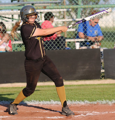 Image: Italy’s Brycelen Richards(17) gets to third base with this rocket launcher of a hit.