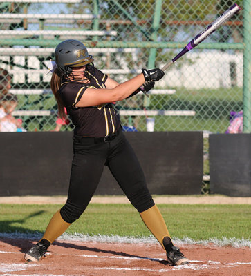 Image: Senior slugger Lillie Perry(9) blasts a double at covington.