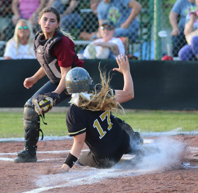Image: Brycelen Richards(17) tries to slide into home base but Riesel was able to get the force out since Italy had the bases loaded.