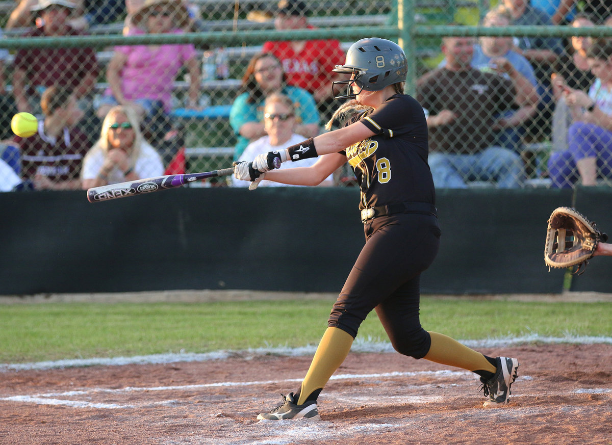 Image: Senior Lady Gladiator Hannah Washington(8) launches a deep ball into Riesel’s outfield.