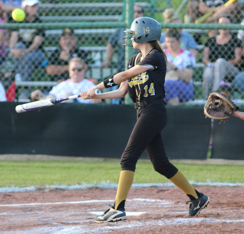 Image: Italy’s Karley Nelson(14) records an RBI when she pops one up and into the outfield to give her runner on third time to come home.