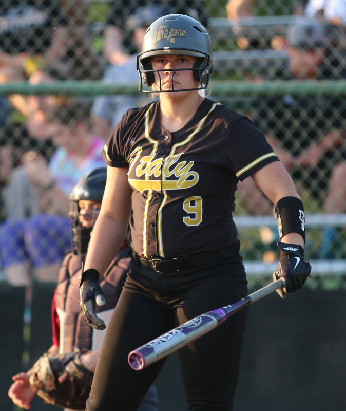 Image: Senior slugger Lillie Perry(9) is ready to win a softball game weather its played on the diamond or in a dark alley somewhere. Be afraid…
