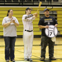 Image: Senior Italy Gladiator Baseball member Ryan Connor(7) is escorted by his parents, Amanda and Scott Connor for Senior Night during a post-game ceremony.