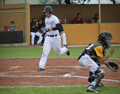 Image: Attaboy! Micah Escamilla(4) demonstrates the proper way to cross home plate, scoring another run for the Gladiators!