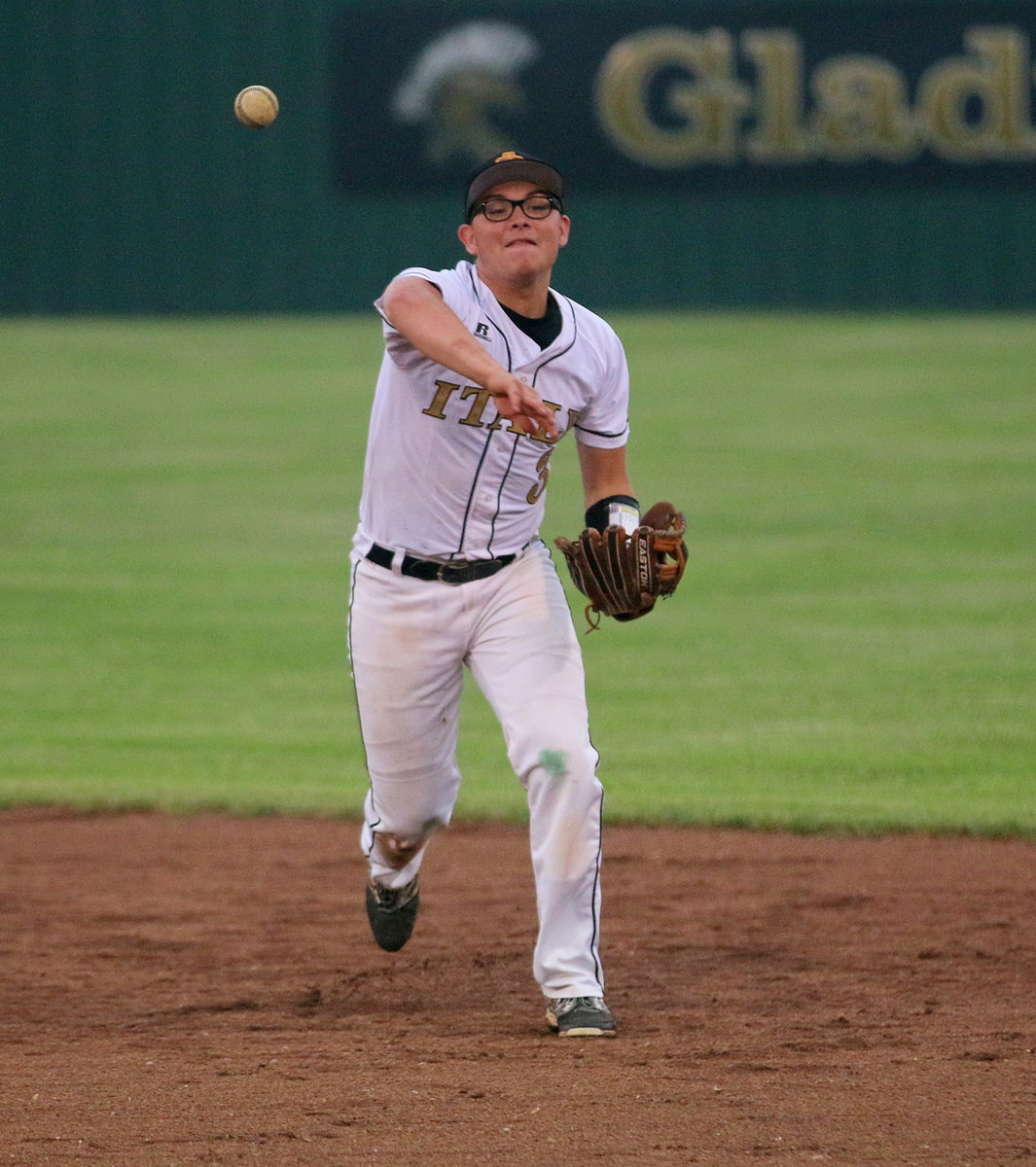 Image: Italy Gladiator second-baseman Eli Garcia(3) warms up between innings.