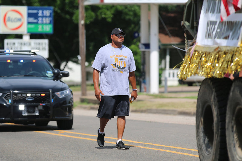 Image: Track Coach Bobby Campbell is a one-man float during Italy’s Parade of Champions.