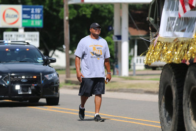 Image: Track Coach Bobby Campbell is a one-man float during Italy’s Parade of Champions.