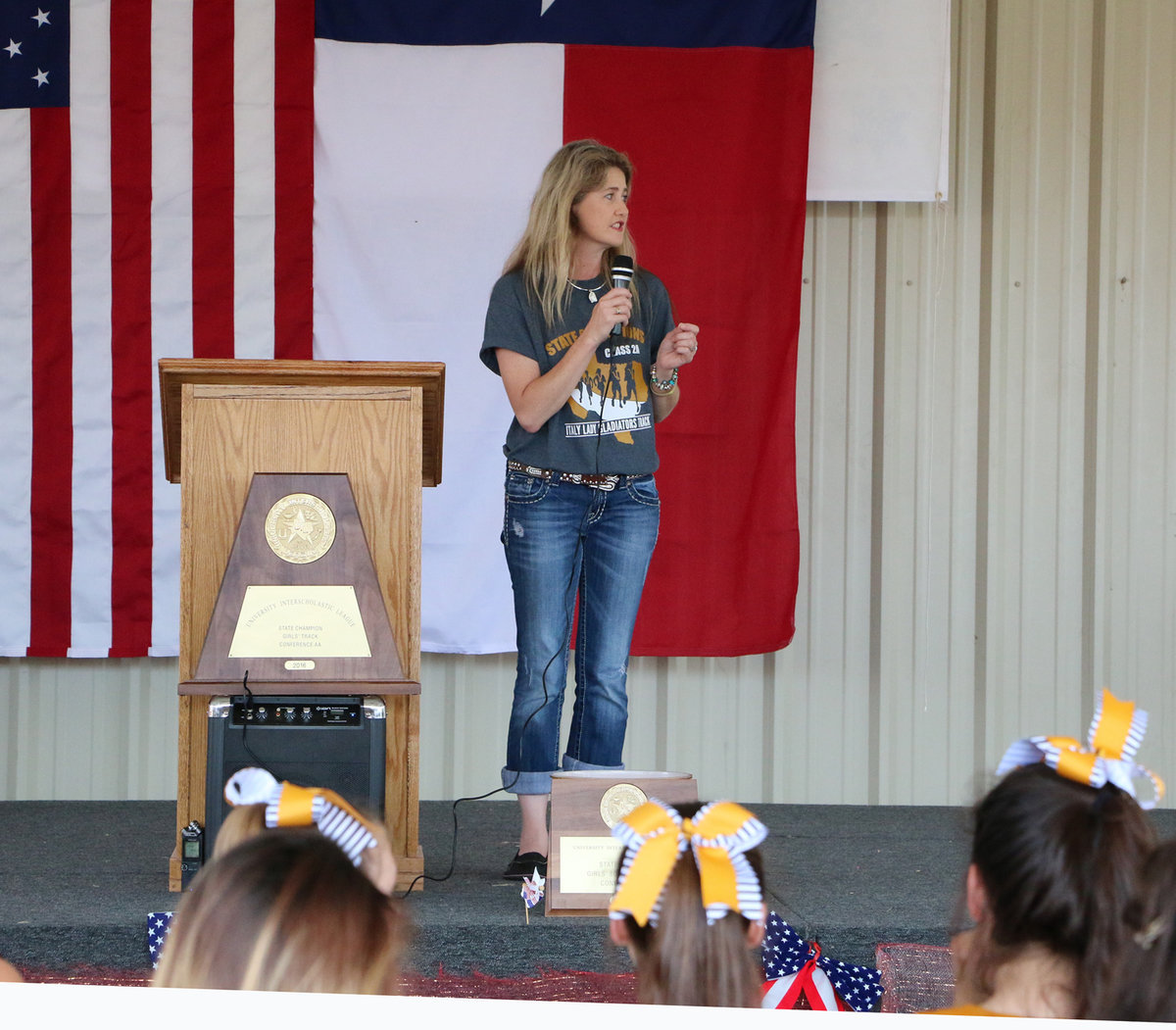 Image: Italy City Manager Ronda Cockerham introduces the Italy Lady Gladiator state champion track team members and their coaches.