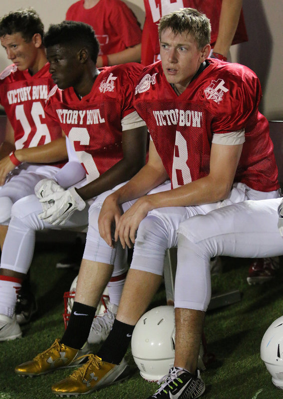 Image: Italy’s Clayton Miller(8) keeps an eye on the action while taking a break on the sideline.