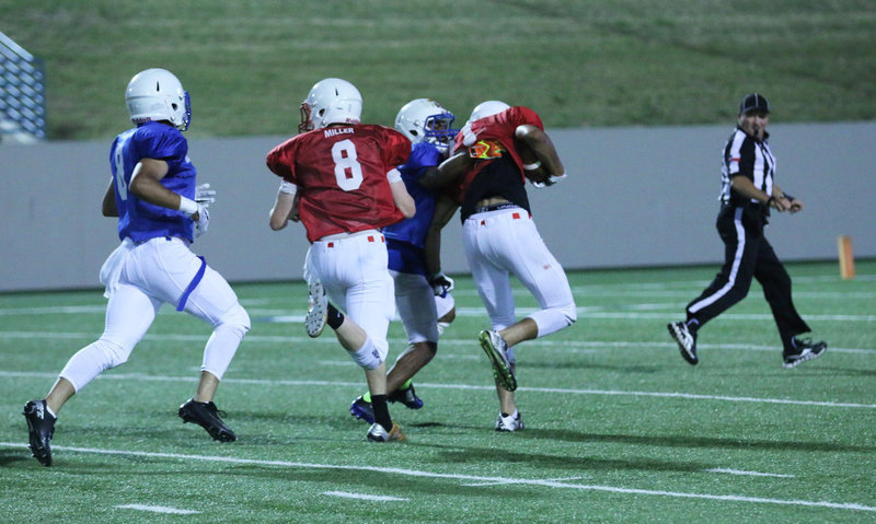 Image: Italy’s Clayton Miller(8) turns blocker as he tries to help his receiving teammate reach the endzone with 1:10 left in the contest. Miller’s Red squad trailed 7-6 when this play covered over 50 yards to setup a possible game-winning field goal.