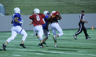 Image: Italy’s Clayton Miller(8) turns blocker as he tries to help his receiving teammate reach the endzone with 1:10 left in the contest. Miller’s Red squad trailed 7-6 when this play covered over 50 yards to setup a possible game-winning field goal.