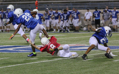 Image: Receiver Clayton Miller(8) has to again transform into to a defender in the pick-of-an-eye after the Blue squad intercepts a pass.