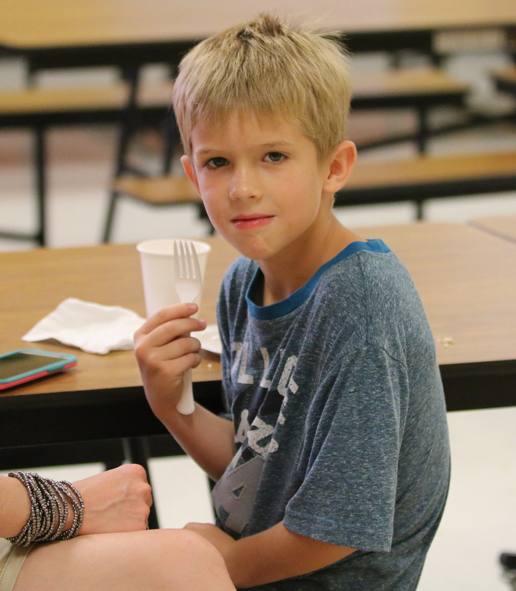 Image: Future band member, Rowan Joffre, attended the event but nothing going on was more important than his having some cake. Go Band!