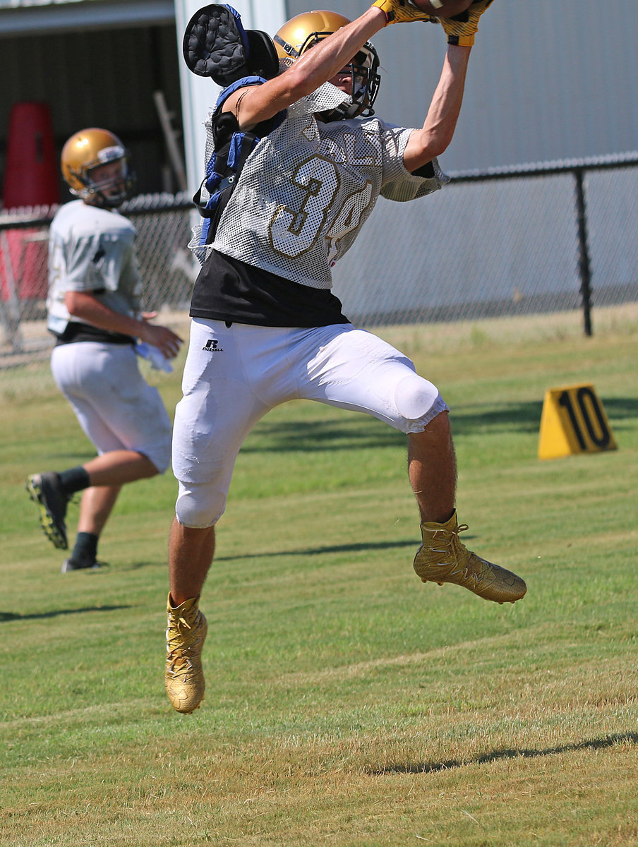 Image: Dyland McCasland(34) leaps to make the grab for the Italy offense.