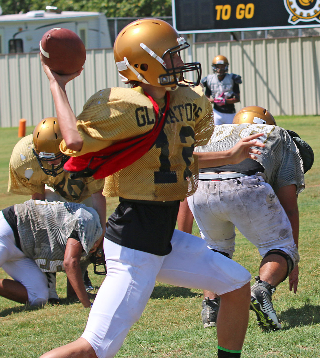 Image: JV quarterback Andrew Oldfield #12  looked strong while leading his bunch toward the endzone.