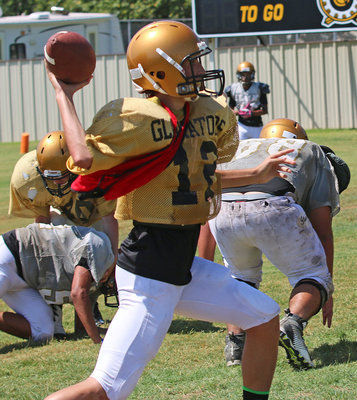 Image: JV quarterback Andrew Oldfield #12  looked strong while leading his bunch toward the endzone.