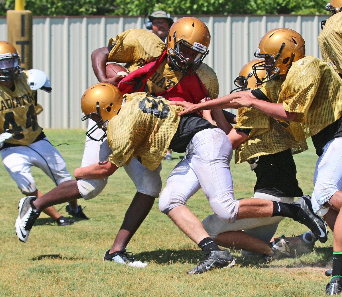 Image: Adam Powell #64 keeps chugging along until he finally punches the ball into the endzone.
