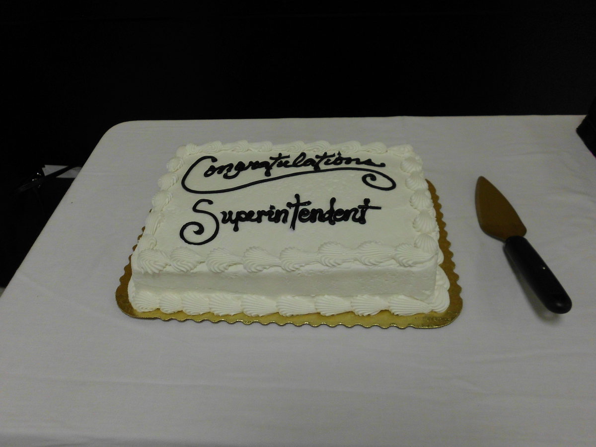 Image: Staff served cake to everyone at the meeting.