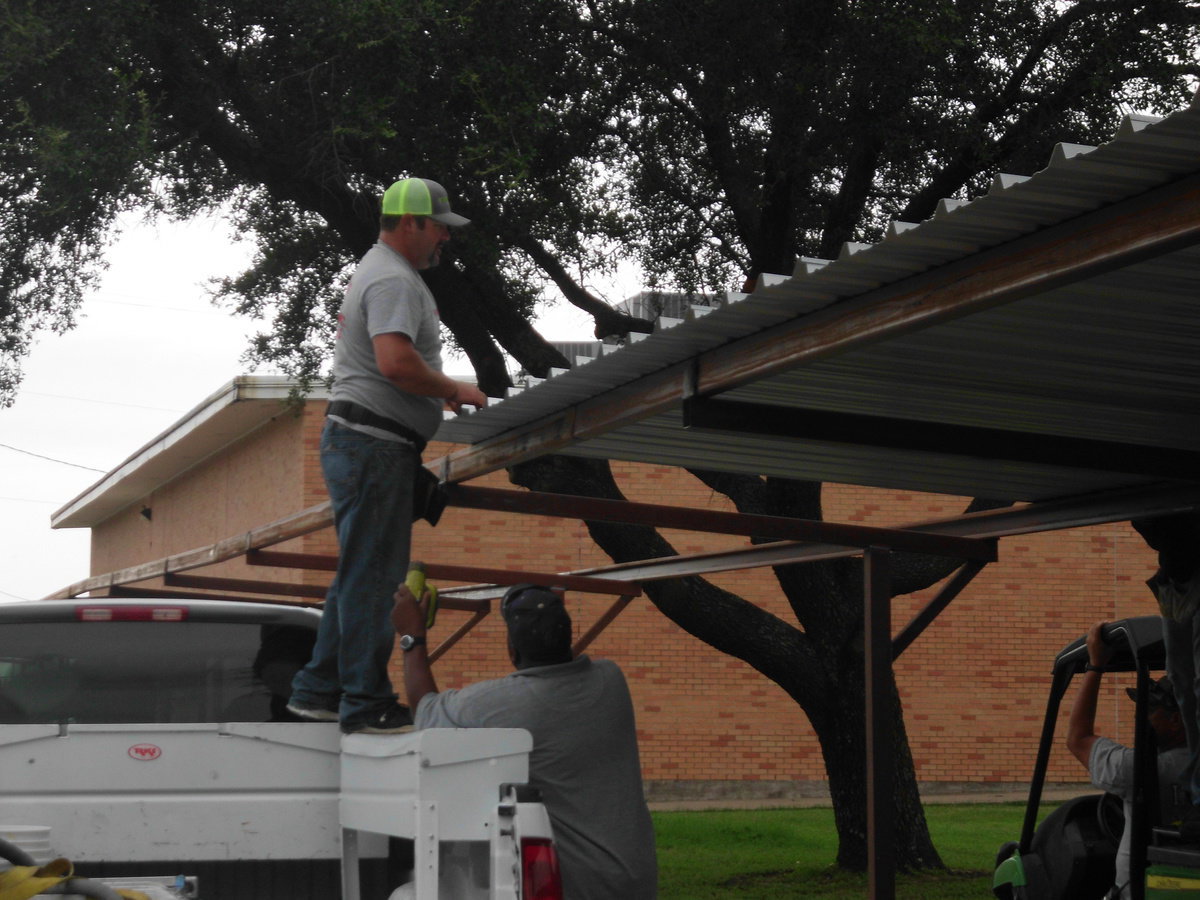 Image: Ken Cate, owner of Cate Welding, is building the covered walkway for the Stafford students.