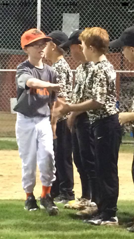 Image: Austin Cate of the Ducks congratulates cousin Rhet Mathers and the rest of the Italy Gladiators team after a competitive tournament championship game between the two squads.