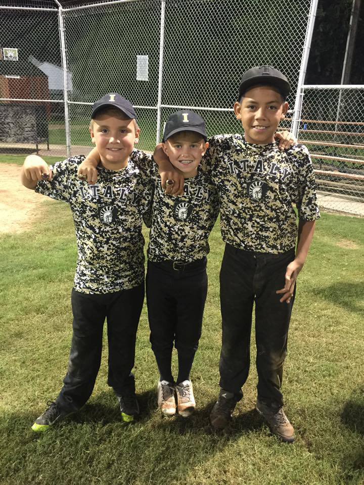 Image: Italy’s Gavin Ramirez, Dustyn Lohner and 
    Jaylen Wallace proudly display their tournament rings.