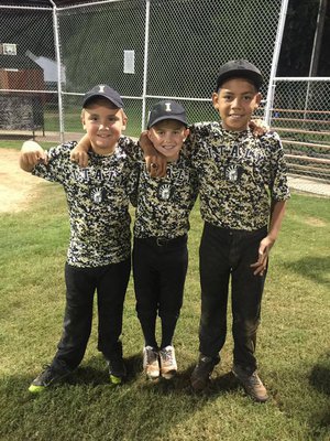 Image: Italy’s Gavin Ramirez, Dustyn Lohner and 
    Jaylen Wallace proudly display their tournament rings.