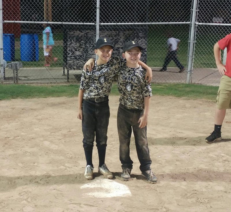 Image: Dustyn Lohner and Gared Wood pose for pictures after securing their tournament rings.