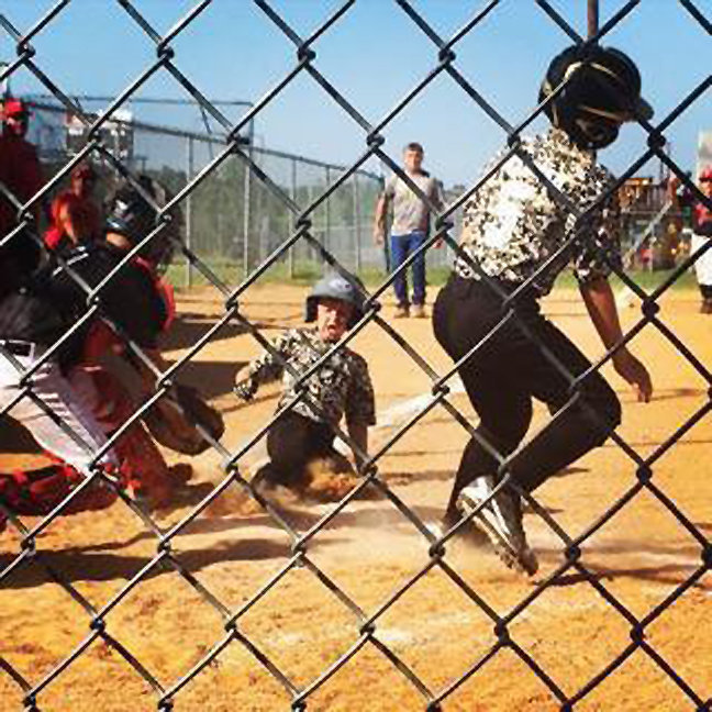 Image: Italy’s Clayton Hellner scores a run followed by a sliding Dustyn Lohner.