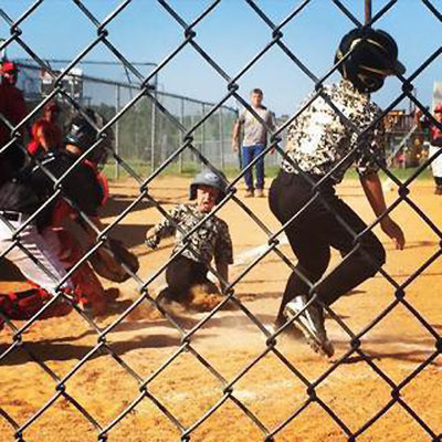 Image: Italy’s Clayton Hellner scores a run followed by a sliding Dustyn Lohner.