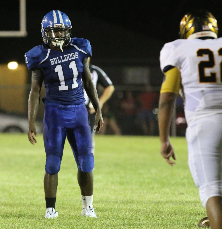 Image: Milford defender #11 Ricky Pendleton glares into the eyes of the Jonesboro offense with the Bulldogs trying to keep the Eagles pushed back against their own goal line late in the fourth.