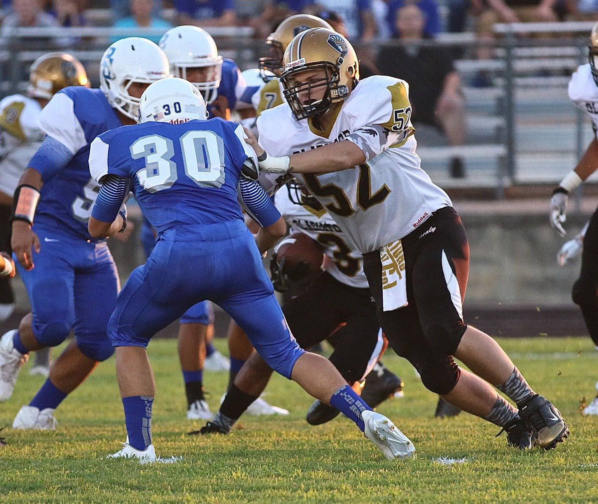 Image: Italy’s #52 James Walton helps clear some running room for the Gladiator backfield.