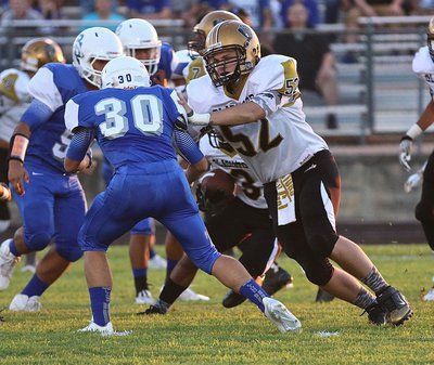 Image: Italy’s #52 James Walton helps clear some running room for the Gladiator backfield.