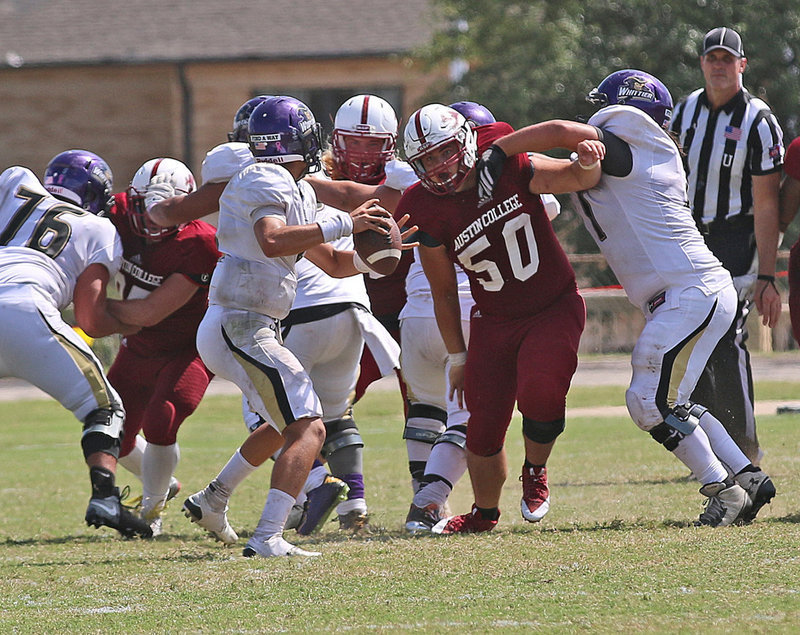 Image: Austin College Kangaroo nose guard #50 Zain Byers, a junior from Italy, Texas, powers his way thru the Whittier Poets’ offensive line.
